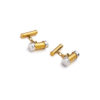 gemelos de oro bicolor con tapones blancos