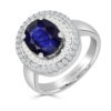 Anillo de oro con zafiro oval diamantes en talla baguette y diamantes talla brillantes